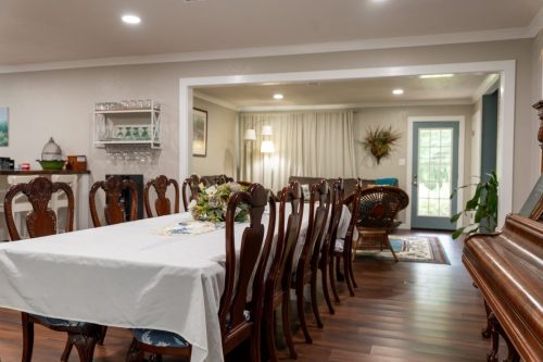 12 Seat Dining Table and Antique Piano
