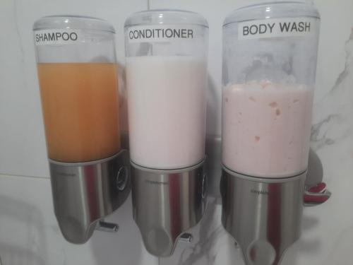 Bathroom #1 - shampoo, conditioner & body wash dispensers